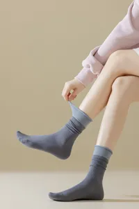 Grey blue dual layer mock two piece mid tube socks detail showcasing fabric texture and fit