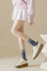 Women's mid-calf ribbed contrast socks detail view, showing the double-layer cuff design clearly.