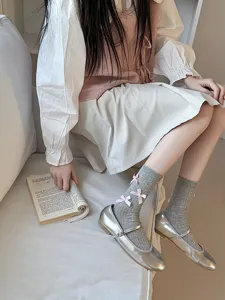 Sweet Lolita bow mid-tube socks for women, cute Japanese preppy style cotton hosiery.