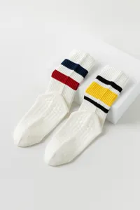 White non-slip yoga socks for women, breathable cotton pilates grip socks with striped cuffs.