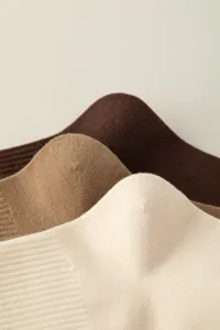 Close-up detail of soft knit texture, showcasing delicate fabric craftsmanship of the socks.