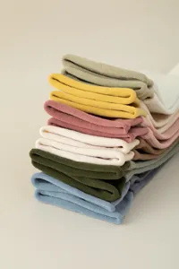Detailed view of colorful knitted mid-tube socks stacked neatly, premium daily wear socks.