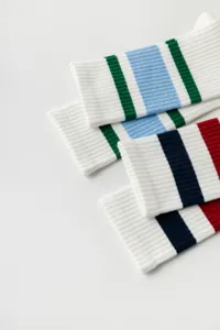 White ribbed yoga sports socks detail showing colorful stripes and soft knit texture.
