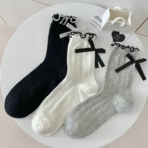 Women Lolita style slouch socks with cute bows and lettuce edge vertical stripe design main view