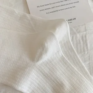 White ribbed mid-tube socks for women, simple Japanese style cotton slouch socks for daily wear.