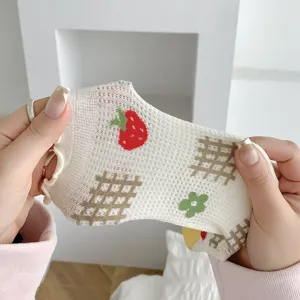 Cute white mesh cotton women socks with sweet strawberry and grid pattern detailed view.