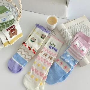 Detailed close-up of cute breathable mesh cotton socks with adorable bear, heart and bow prints.