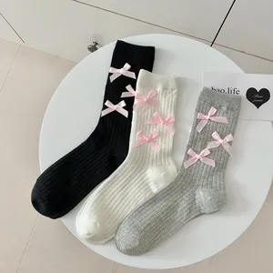 Cute bow mid-tube socks for women, sweet Lolita style knitted socks in black white grey.