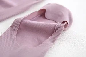 Close-up detail of women's pink shallow-mouth invisible boat socks with cotton sole.