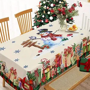 Vista detallada del mantel navideño impermeable con muñeco de nieve y regalo para decoración.