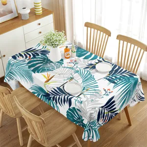 Waterproof rectangular dining tablecloth with green tropical leaf pattern for summer decor.