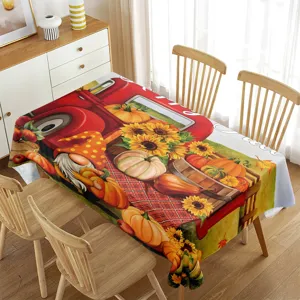 Waterproof autumn tablecloth featuring red truck and pumpkin print for holiday dining table decor.