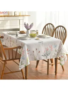 Detalle de mantel impermeable con estampado floral en estilo de decoración primaveral.