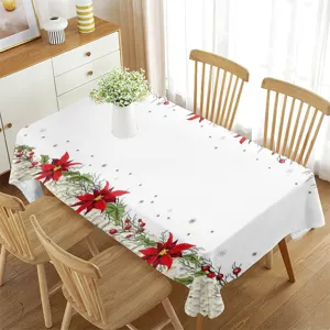 Vista dettagliata della tovaglia natalizia con fiori di poinsettia rossa per la sala da pranzo.