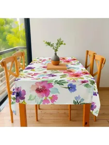 Vista detallada del mantel con diseño de flores en acuarela colorido en el comedor principal.