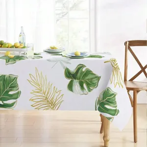 Mantel rectangular impermeable con diseño de hojas tropicales verdes para el hogar.