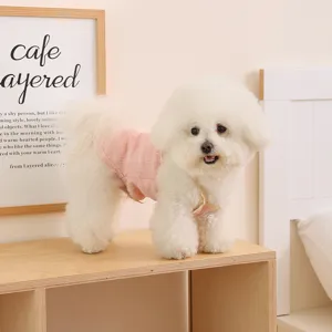 Breathable summer pet vest for small dogs, featuring delicate pink lace trim and cute details.