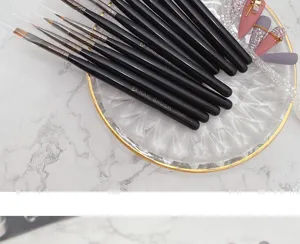 Professional 12-piece nail art brush set with black handles for fine line painting and carving.