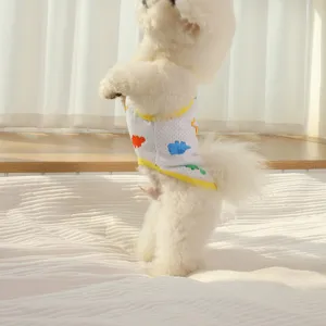 Summer breathable mesh pet vest with cute colorful dinosaur print and yellow trim for small dogs.