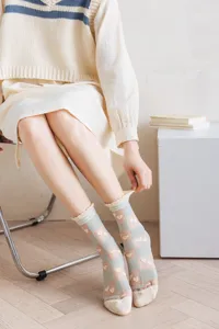 Sheer mesh grid socks with cute heart patterns, breathable summer vintage style hosiery for women.