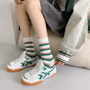 Detailed view of stylish green and pink striped mid-tube socks, perfect for Japanese college style.