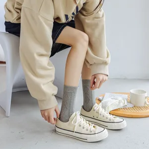 Cozy grey cotton mid-tube socks featuring delicate argyle patterns for daily women wear.