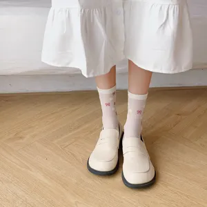 Sweet white mid-tube socks featuring cute bow patterns, perfect for Japanese JK style outfits.