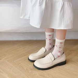 White mid-calf socks for women featuring cute red bows and strawberry patterns, sweet JK style.