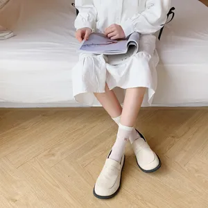 Cute Japanese style white mid-calf socks for women, sweet breathable socks for daily wear.