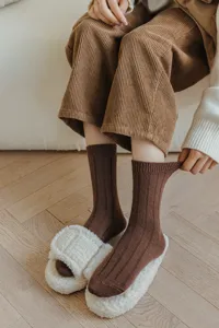 Brown ribbed wool socks for women, cozy winter mid-tube slouchy knit socks and fuzzy slippers.