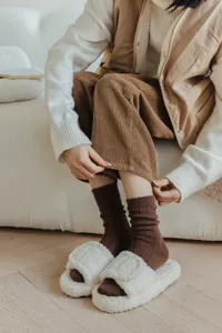 Cozy brown ribbed knit wool socks detail shot, soft winter vintage style daily wear comfort.