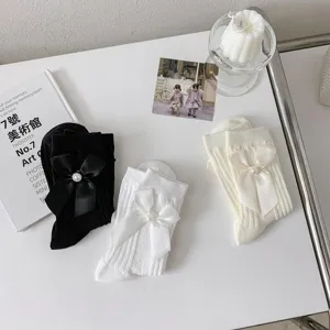 Chaussettes hautes Lolita avec nœud mignon noir blanc JK chaussettes perles pour femmes