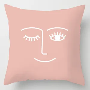 Pink abstract face throw pillow cover detail, modern minimalist design, soft polyester.