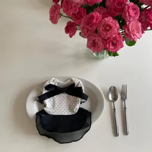 Cute polka dot pet dress with black bow, soft fabric, stylish apparel for small dogs and cats.