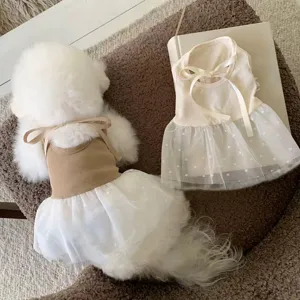 Cute spring summer pet dress with polka dot mesh skirt and sweet bow for small dogs and cats.