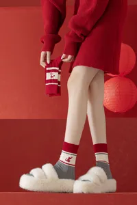 Red knit mid-tube socks for women featuring cute snake embroidery and cozy striped design.