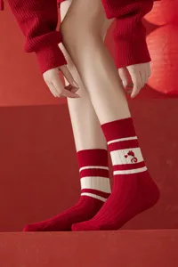 Red knit mid-calf socks featuring white stripes and cute snake embroidery for daily wear.