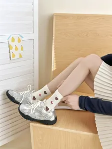 Cute cartoon embroidered mid-calf socks for women, Japanese style daily wear detail shot.