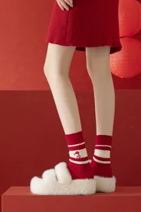 Red knitted mid-tube socks with cute snake embroidery, festive winter thermal hosiery.
