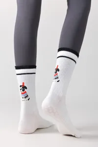 Close-up detail of white split-toe yoga socks with cute dog print and non-slip silicone.