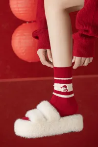 Red knit women's socks, Year of the Snake design with cute embroidery and cozy stripes.