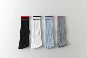 Close-up detail of women's five-toe sports socks with striped cuff in multiple colors.