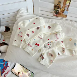 Cute cotton mid-tube socks with sweet cartoon heart and bear patterns, perfect for daily wear.