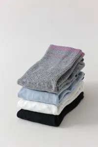 Comfortable women's mid-tube socks in a multi-color stacked set, soft and breathable knit.