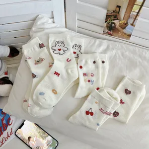 Cute cartoon print white crew socks for women, sweet Japanese style cotton hosiery.