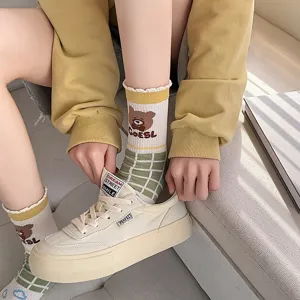 Cute cartoon bear mid-calf cotton socks with green plaid pattern and casual canvas shoes.