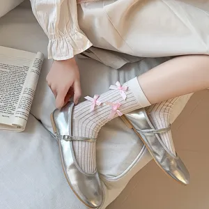 Japanese sweet Lolita style mid-tube socks with cute pink bow decorations and silver shoes.