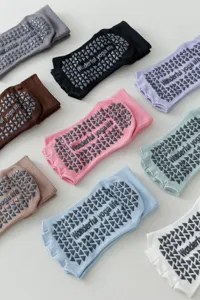 Non-slip yoga socks with silicone grips, open toe five-finger design for pilates exercise.