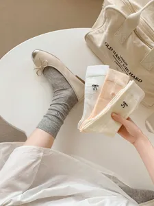 Women's mesh thin mid-tube socks with delicate bow embroidery, breathable and stylish.