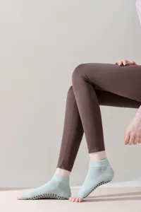 Close-up of toe-less five-toe grip socks with anti-slip silicone bottom for yoga and pilates.